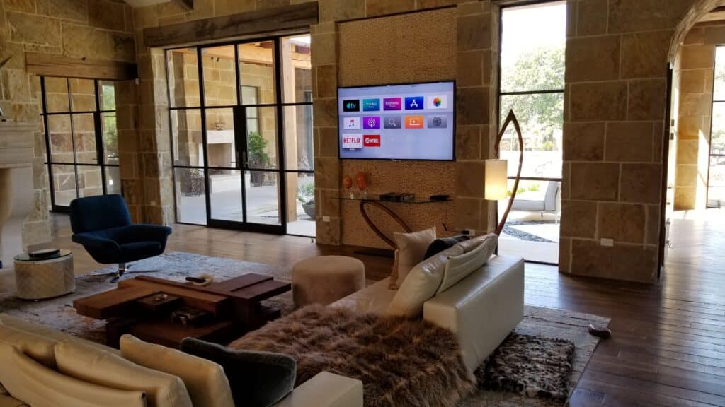 Modern living room with wall-mounted smart TV and elegant décor.