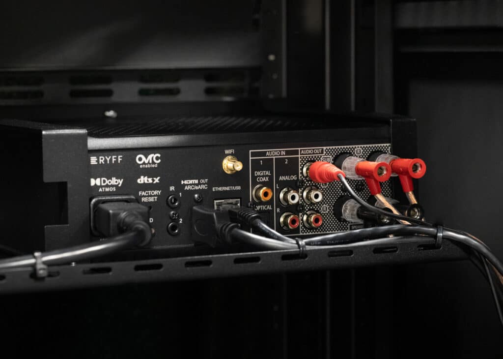 Close-up of AV receiver with connected audio cables.