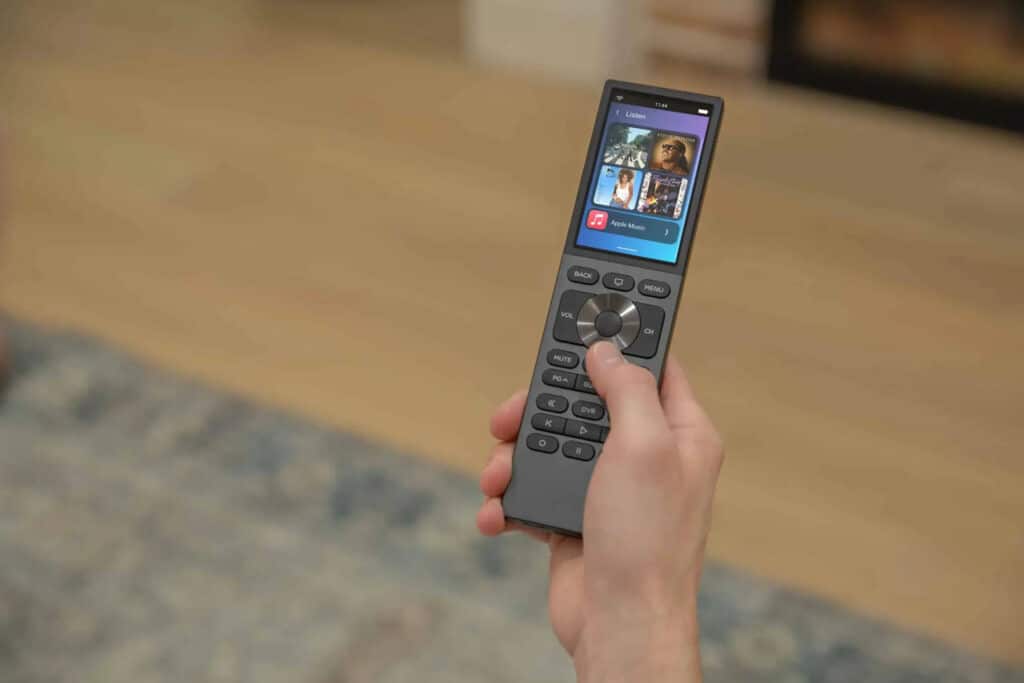 person holding the controls to a smart home